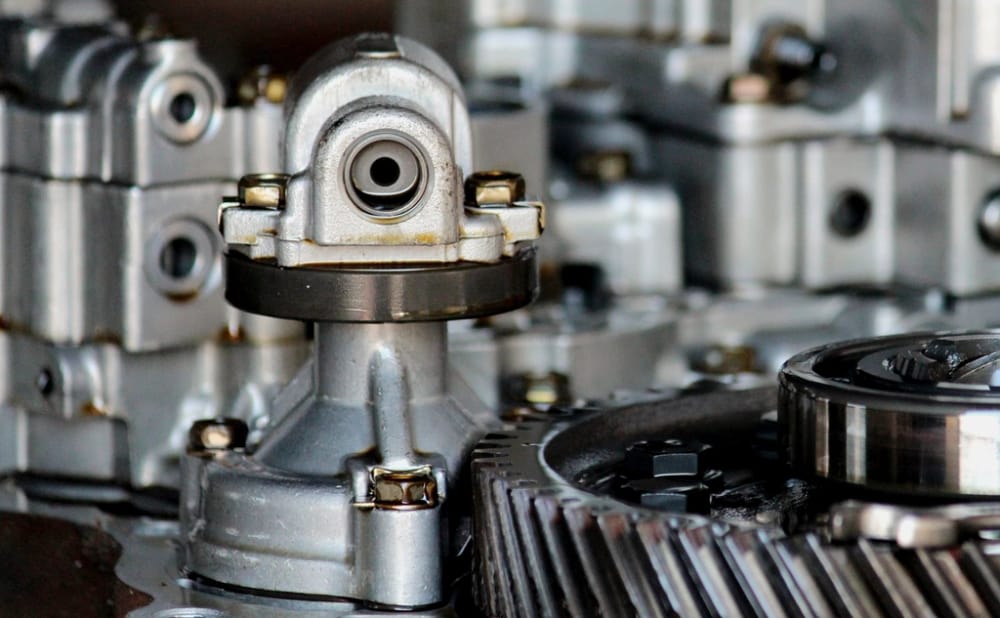 Machined gearbox internals, the automotive industry page hero.