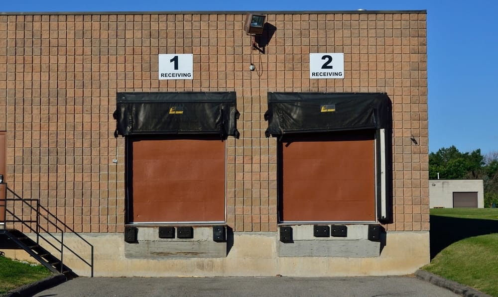 Signed receiving dock doors, the distribution industry page hero.